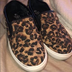 Pair of leopard slip on shoes